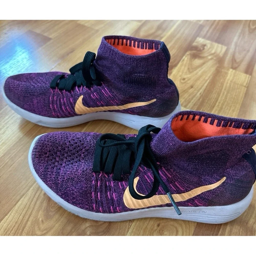 Nike LunarEpic Flyknit running shoes in a purple colorway with an orange swoosh.